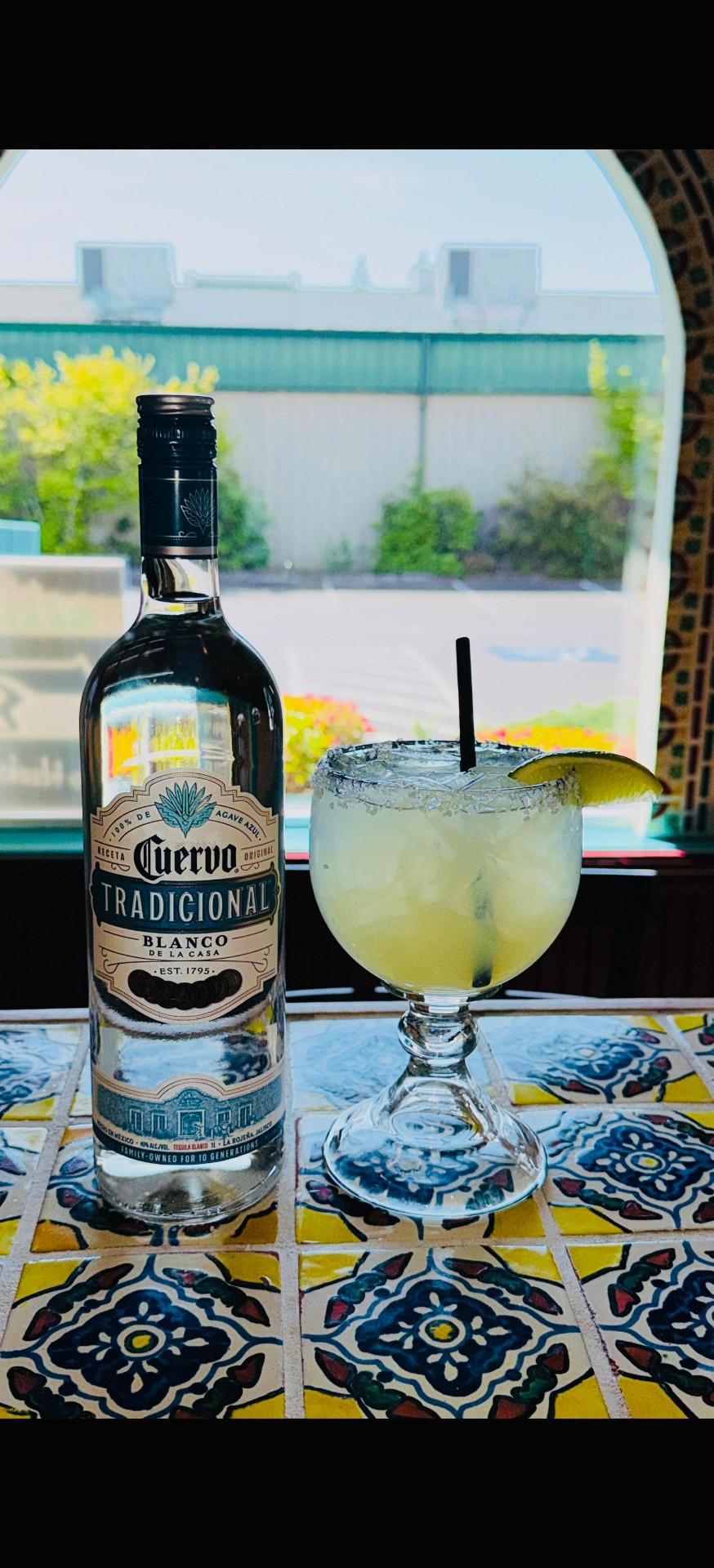 Classic Cuervo Tradicional margarita on the rocks with salt rim and lime