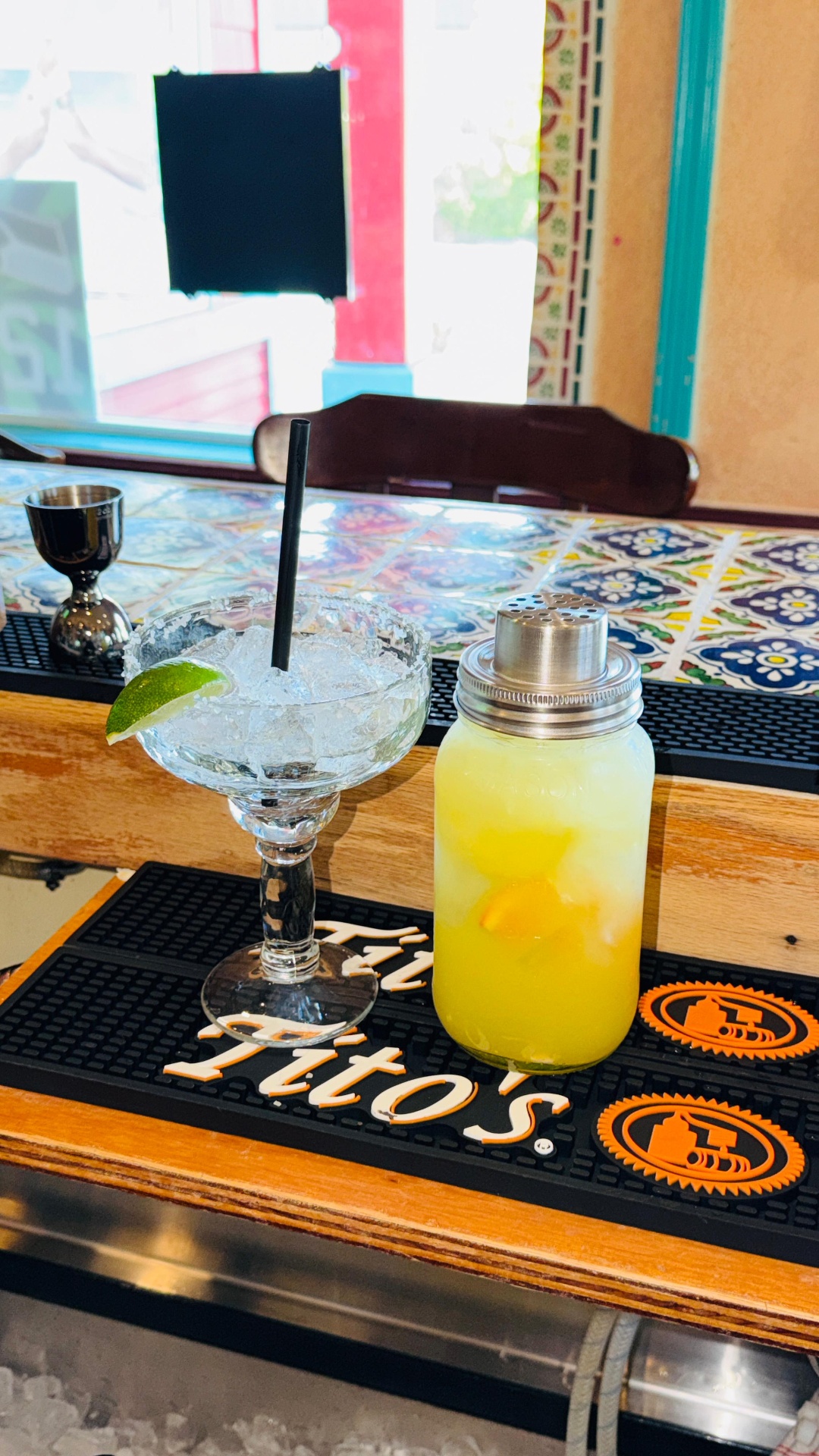 Tito's margarita on the rocks with lime and fresh citrus mix