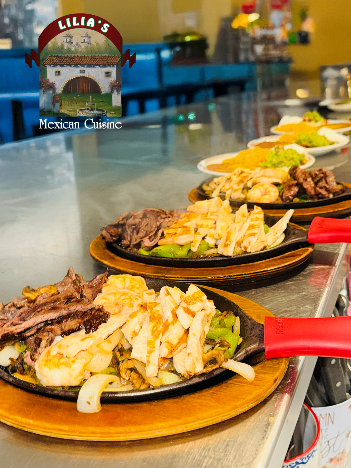 Sizzling fajita skillets lined up in the kitchen